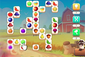 Ecrã de puzzle colorido com peças de frutas, cursor em forma de mão e cenário rural com celeiro e vaca